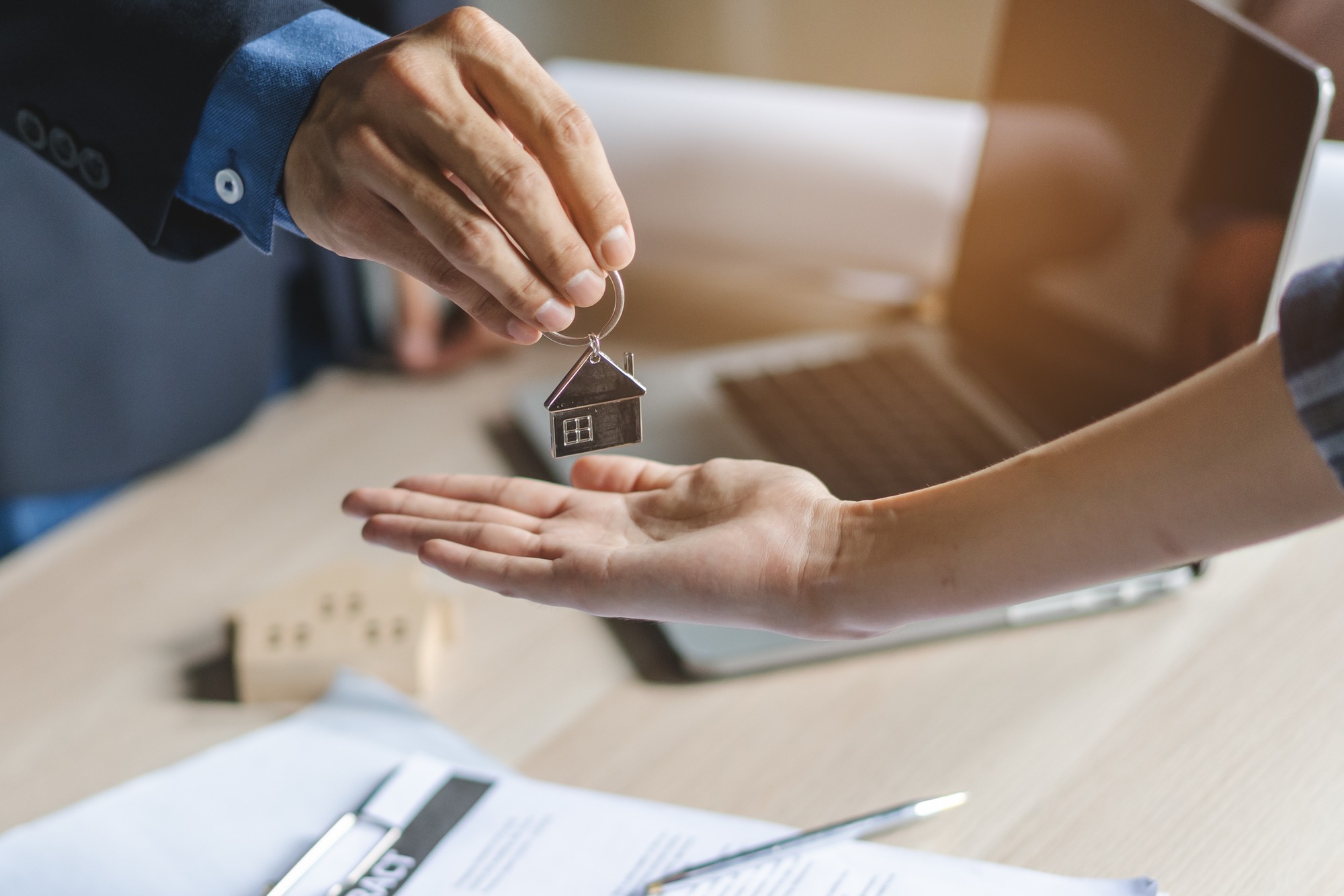 Landlord giving key house to buyer